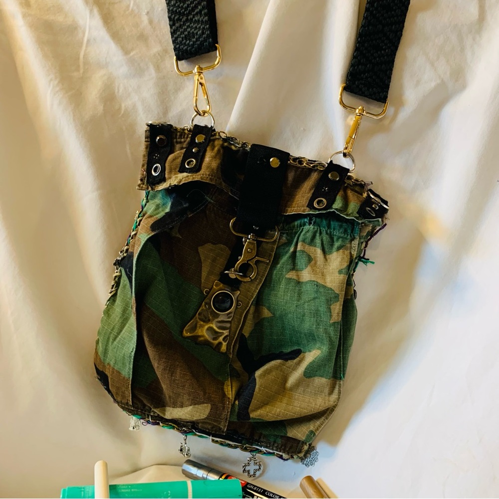 Camouflage Crossbody Bag with Gold Accents and Image of JK Punkmetal Sculpture. - Picture 3 of 7